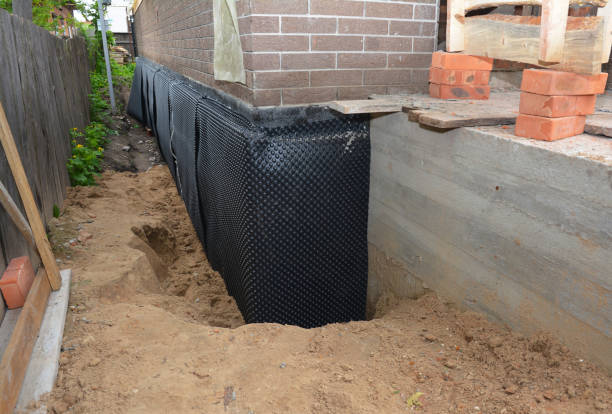 Happy homeowners after waterproofing job in Sunman